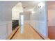 Hallway features hardwood floors, decorative wallpaper, and elegant lighting at 1477 Shadwell Cir, Lake Mary, FL 32746