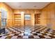 The living room features paneled walls, built-in shelving and checkered floors creating a unique and inviting atmosphere at 1477 Shadwell Cir, Lake Mary, FL 32746