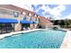 Estate featuring a sparkling backyard pool and covered lanai with blue awnings at 1477 Shadwell Cir, Lake Mary, FL 32746