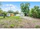 The backyard showcases ample green space with neighboring homes visible in the distance at 1502 S Summerlin Ave, Sanford, FL 32771