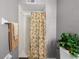Bathroom shower featuring neutral colored shower curtain and modern decor at 1502 S Summerlin Ave, Sanford, FL 32771