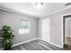 This bright bedroom features new flooring, a window and a closet at 1502 S Summerlin Ave, Sanford, FL 32771