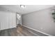 Bedroom featuring gray walls and gray flooring with attached bathroom at 1502 S Summerlin Ave, Sanford, FL 32771