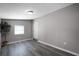Bedroom featuring gray walls, modern decor, gray flooring, and a closet at 1502 S Summerlin Ave, Sanford, FL 32771
