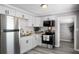 Close up of updated kitchen featuring white cabinets, stainless steel appliances, and granite countertops at 1502 S Summerlin Ave, Sanford, FL 32771