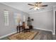 Bright living room boasts modern floors, stylish furnishings, and plenty of natural light at 1502 S Summerlin Ave, Sanford, FL 32771