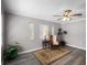 Relaxing living room showcasing updated flooring, neutral color palette, and comfortable furnishings at 1502 S Summerlin Ave, Sanford, FL 32771
