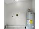 Utility room with water heater, tile floor, and laundry connections at 1502 S Summerlin Ave, Sanford, FL 32771