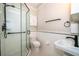 Clean bathroom featuring a glass shower, tiled floors and modern fixtures at 1505 Delaney Ave, Orlando, FL 32806