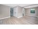Neutral bedroom with closet, bathroom and vinyl floors at 1505 Delaney Ave, Orlando, FL 32806