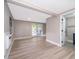 Bedroom with vinyl floors, sliding glass door and access to a bathroom at 1505 Delaney Ave, Orlando, FL 32806