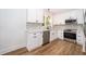Bright kitchen with modern appliances, new countertops, and white cabinetry at 1505 Delaney Ave, Orlando, FL 32806
