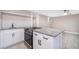 Modern kitchen features granite countertops, stainless steel appliances and ample cabinet space at 1505 Delaney Ave, Orlando, FL 32806