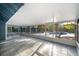 This screened lanai offers tile flooring and views of the pool and landscaped backyard for outdoor living at 1505 Delaney Ave, Orlando, FL 32806