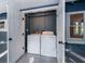 Convenient laundry room featuring a washer and dryer with easy access from the home at 1505 Delaney Ave, Orlando, FL 32806
