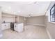 Bright living room with kitchen area, stainless steel appliances and an inviting open floor plan at 1505 Delaney Ave, Orlando, FL 32806