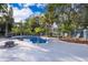 Inviting kidney-shaped pool surrounded by a spacious patio with seating area at 1505 Delaney Ave, Orlando, FL 32806