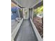 Screened-in porch with tiled floor, leading to the house and backyard at 1505 Delaney Ave, Orlando, FL 32806