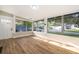 Bright sunroom with large windows, offering panoramic views and ample natural light, perfect for a relaxing retreat at 1505 Delaney Ave, Orlando, FL 32806