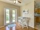 Bright dining area features hardwood floors, access to the kitchen and direct access to the outdoor patio at 1618 Oregon Ave, St Cloud, FL 34769