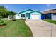 Charming, updated single-Gathering home with a well-manicured lawn, new landscaping, and an attached garage at 1618 Oregon Ave, St Cloud, FL 34769
