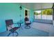 Screened in patio featuring comfortable seating and a view of the outdoors at 1618 Oregon Ave, St Cloud, FL 34769