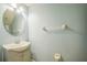 Bright and airy bathroom with a sink and a classic round mirror at 16449 Cedar Crest Dr, Orlando, FL 32828