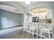 Inviting living room open to the kitchen area with bar stool seating at 16449 Cedar Crest Dr, Orlando, FL 32828