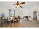 Spacious dining room with wood-look floors, crown molding, and neutral decor at 1649 W Waycross Cir, Deltona, FL 32725
