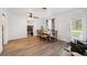 Spacious dining room with wood-look floors, crown molding, and neutral decor at 1649 W Waycross Cir, Deltona, FL 32725