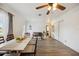 Spacious dining room with wood-look floors, crown molding, and neutral decor at 1649 W Waycross Cir, Deltona, FL 32725