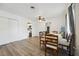 Spacious dining room with wood-look floors, crown molding, and neutral decor at 1649 W Waycross Cir, Deltona, FL 32725