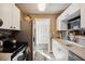 Bright kitchen features white cabinets, stainless steel appliances, and modern backsplash at 1649 W Waycross Cir, Deltona, FL 32725