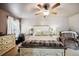 Comfortable main bedroom features a queen bed, neutral tones, and natural light at 1649 W Waycross Cir, Deltona, FL 32725