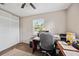 Carpeted office space with desk, chair, rug, and sliding closet doors at 1649 W Waycross Cir, Deltona, FL 32725