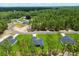 Aerial view showcasing the house among lush greenery, highlighting neighborhood at 17477 Sw 41St Cir, Ocala, FL 34473