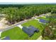 Aerial view of home nestled among lush greenery, showcasing its expansive lot at 17477 Sw 41St Cir, Ocala, FL 34473