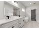 Modern bathroom with double vanity, soaking tub, and walk-in shower at 17477 Sw 41St Cir, Ocala, FL 34473