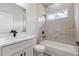 Stylish bathroom with a marble-style tiled shower and a sleek white vanity at 17477 Sw 41St Cir, Ocala, FL 34473