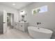 Bright bathroom with a soaking tub and double vanity at 17477 Sw 41St Cir, Ocala, FL 34473