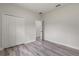 Bedroom featuring a closet, wood floors, and a view to another room at 17477 Sw 41St Cir, Ocala, FL 34473