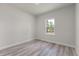 Bedroom featuring wood floors and a window with a view at 17477 Sw 41St Cir, Ocala, FL 34473