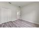 Comfortable bedroom with a closet, wood floors, and access to another room at 17477 Sw 41St Cir, Ocala, FL 34473