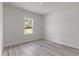Cozy bedroom with wood floors and a bright window that offers a pleasant view at 17477 Sw 41St Cir, Ocala, FL 34473