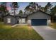 Charming single-Gathering home featuring a well-manicured lawn, a two car garage, and professional landscaping at 17477 Sw 41St Cir, Ocala, FL 34473