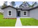 Charming single-Gathering home featuring a well-manicured lawn and an inviting front entrance at 17477 Sw 41St Cir, Ocala, FL 34473