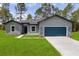 Charming single-Gathering home featuring a well-manicured lawn, a two car garage, and professional landscaping at 17477 Sw 41St Cir, Ocala, FL 34473