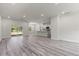 Open-concept living area with modern flooring and sliding glass doors to the backyard at 17477 Sw 41St Cir, Ocala, FL 34473