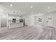 Spacious living area with modern flooring, an open floorplan, and recessed lighting at 17477 Sw 41St Cir, Ocala, FL 34473