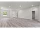 Bright and airy living room with an open floorplan, modern flooring, and recessed lighting at 17477 Sw 41St Cir, Ocala, FL 34473